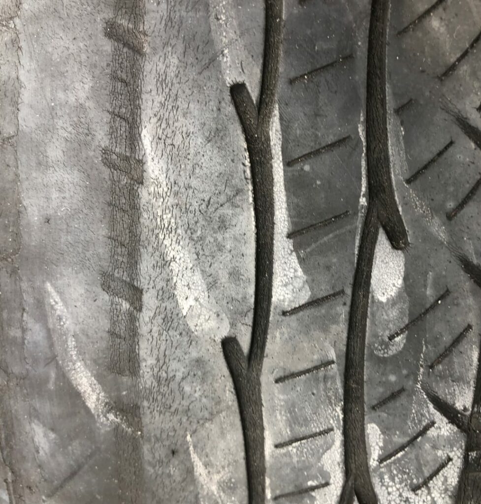 A tire with a camber wear pattern