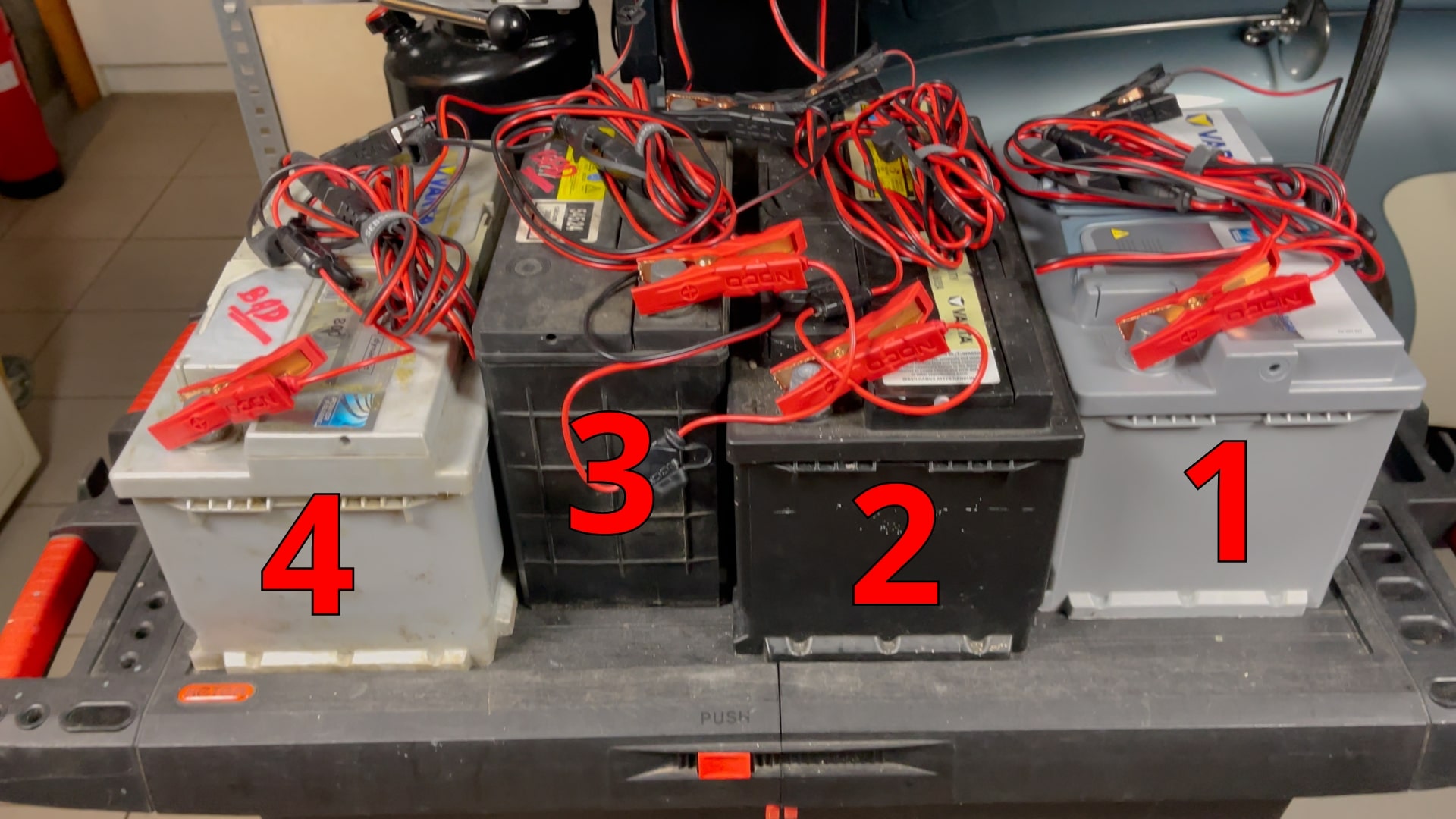 The test setup of four different car batteries that are used to test the battery tester