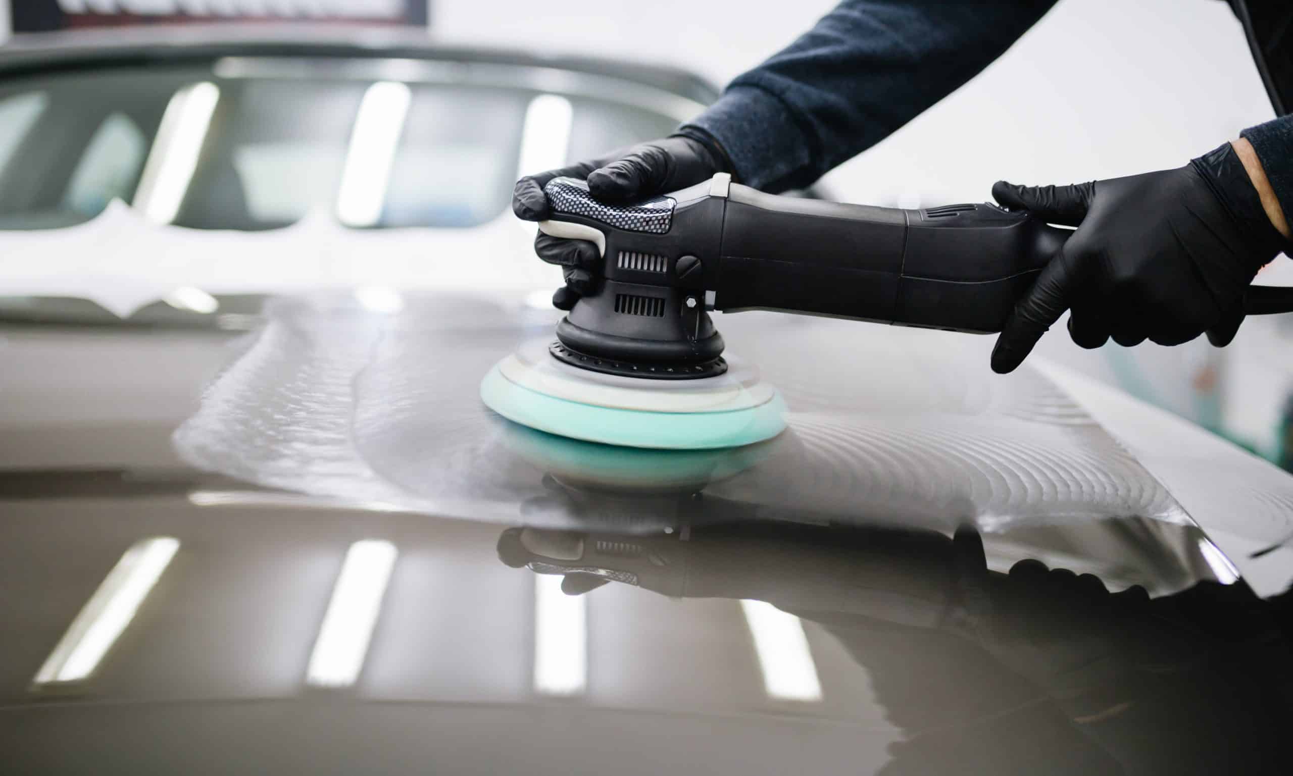 Polishing a car with a polisher